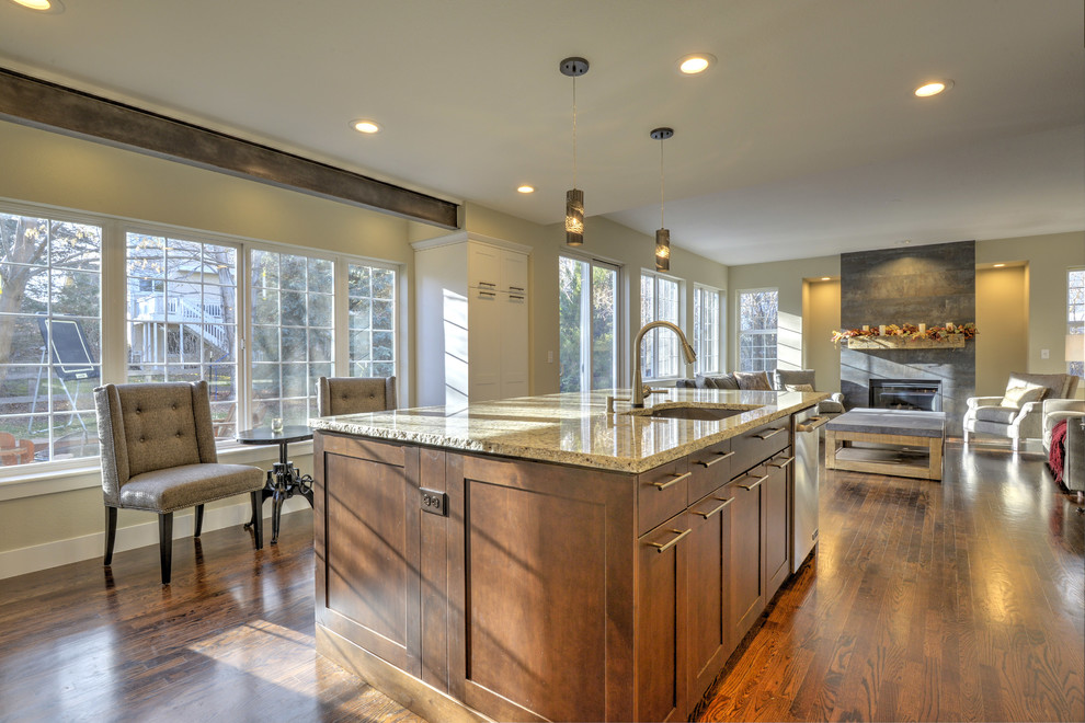 This is an example of a large transitional kitchen in Denver with a single-bowl sink, shaker cabinets, white cabinets, granite benchtops, ceramic splashback, stainless steel appliances, dark hardwood floors, with island and brown floor.