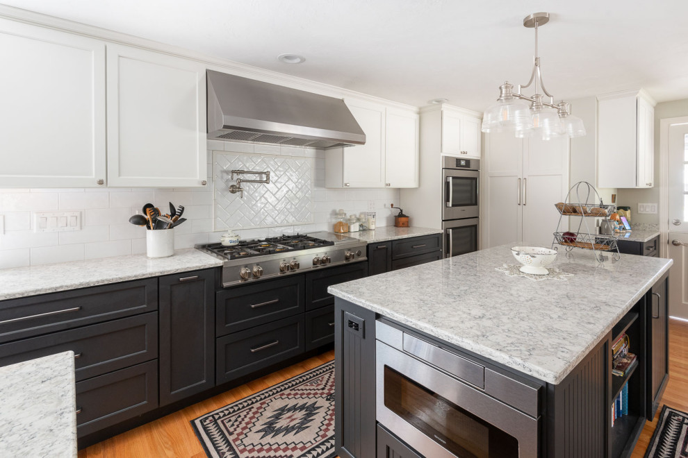 Inspiration for a huge transitional galley medium tone wood floor and brown floor eat-in kitchen remodel in Boston with a farmhouse sink, shaker cabinets, blue cabinets, quartz countertops, white backsplash, subway tile backsplash, stainless steel appliances, two islands and white countertops