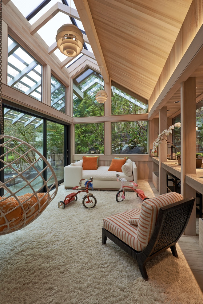 Design ideas for a large contemporary sunroom in Portland with a skylight.