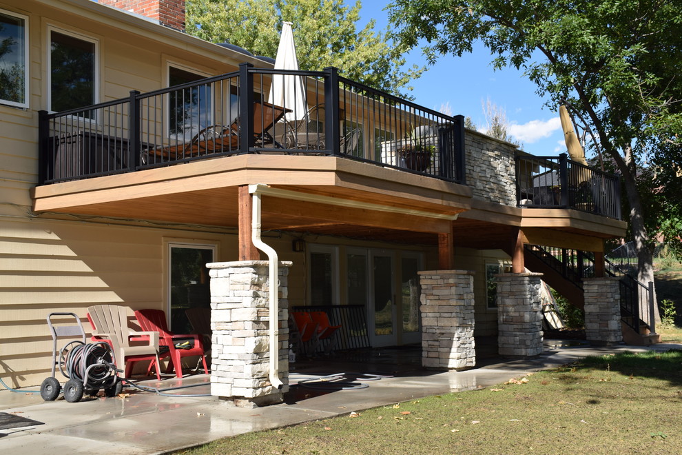 Photo of a large arts and crafts backyard deck in Denver with an outdoor kitchen and no cover.