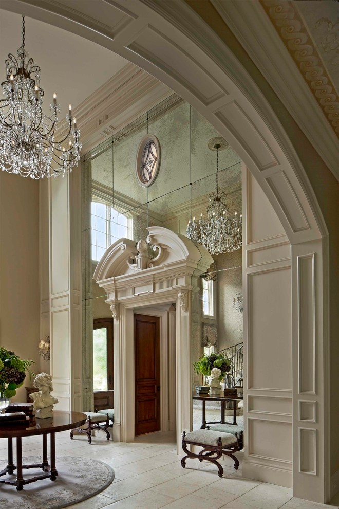 Photo of a large traditional foyer in Detroit with beige walls and ceramic floors.