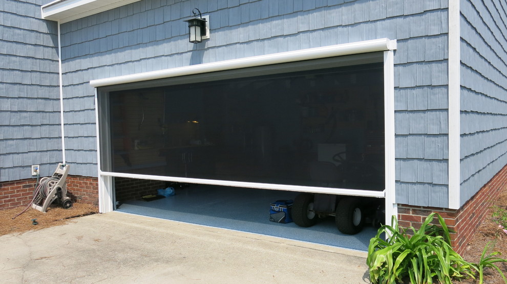 Mid-sized transitional attached one-car garage photo
