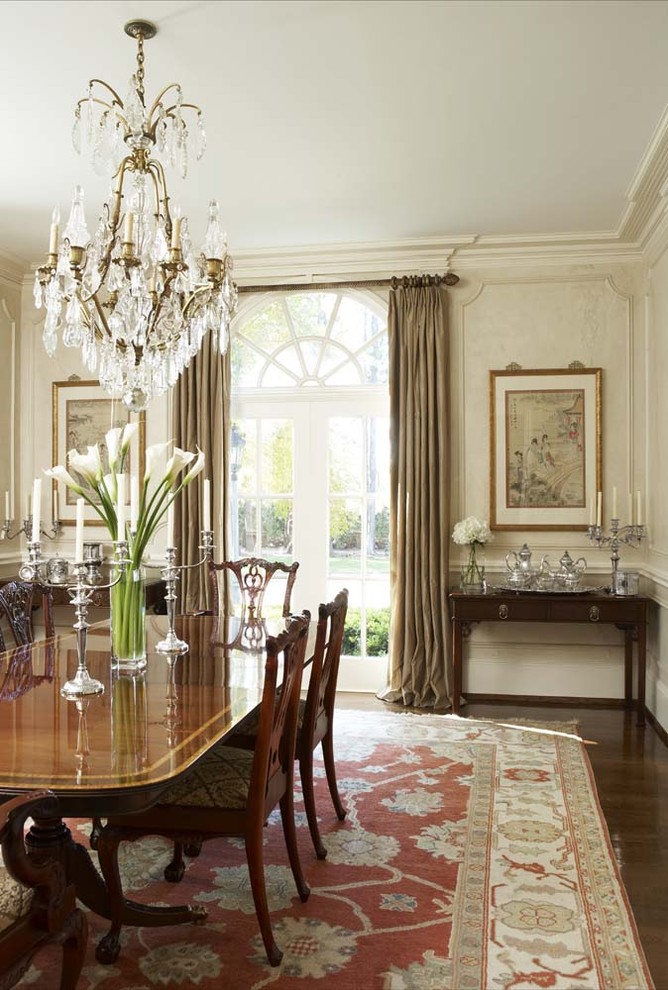Large traditional dining room in Other with white walls, dark hardwood floors and no fireplace.
