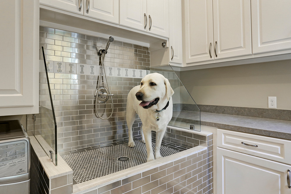 Inspiration for a timeless utility room remodel in Houston with raised-panel cabinets and white cabinets