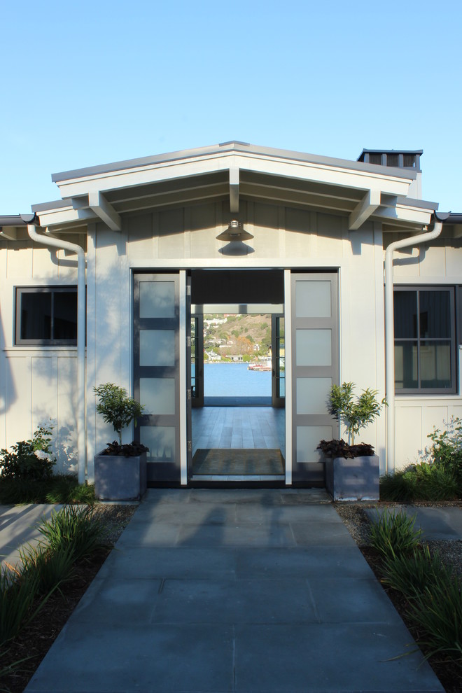 Photo of a beach style front door in San Francisco with a single front door and a glass front door.