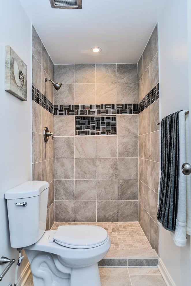 Inspiration for a small transitional 3/4 bathroom in Louisville with recessed-panel cabinets, dark wood cabinets, an open shower, a two-piece toilet, beige tile, porcelain tile, white walls and porcelain floors.