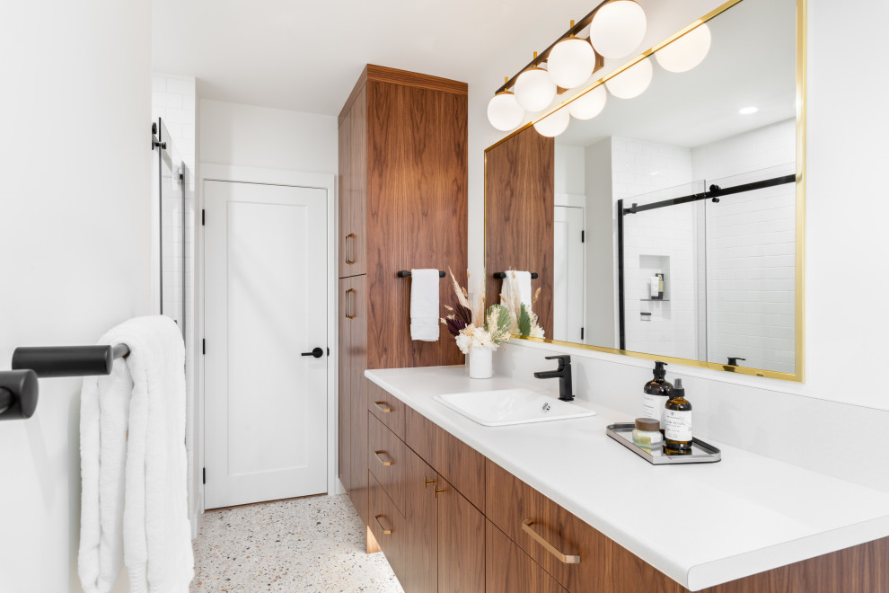 Photo of a medium sized midcentury shower room bathroom in Vancouver with an alcove bath, an alcove shower, a two-piece toilet, white tiles, ceramic tiles, white walls, terrazzo flooring, a built-in sink, laminate worktops, white floors, a sliding door, white worktops, a single sink and a floating vanity unit.