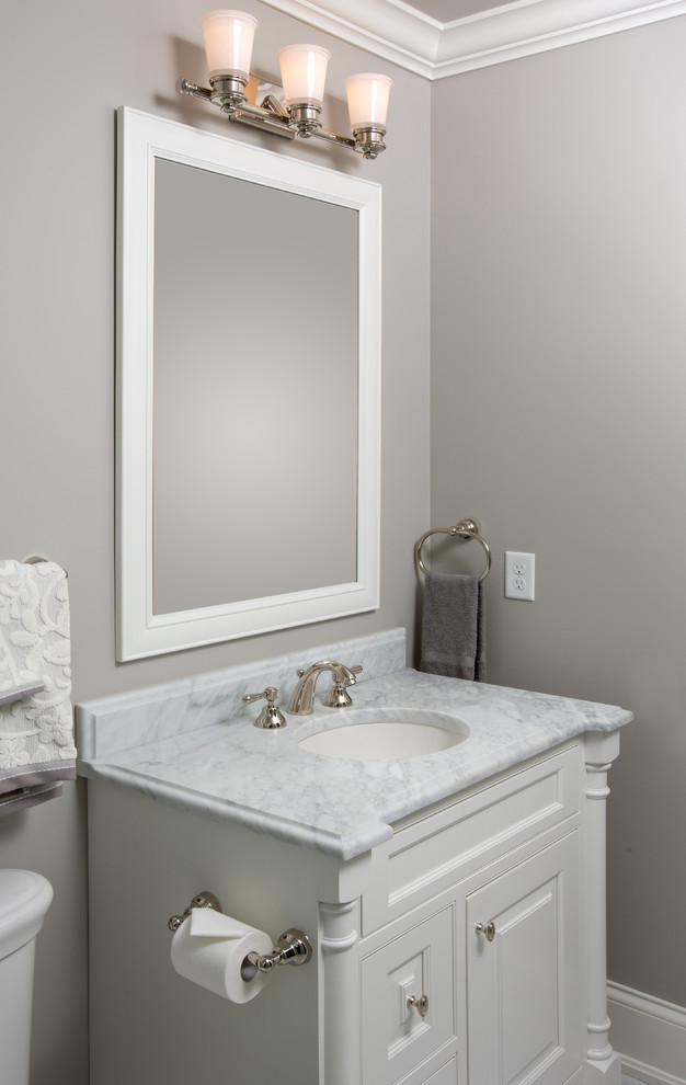 This is an example of a mid-sized traditional kids bathroom in Columbus with an undermount sink, beaded inset cabinets, white cabinets, marble benchtops, gray tile, stone tile, grey walls and marble floors.