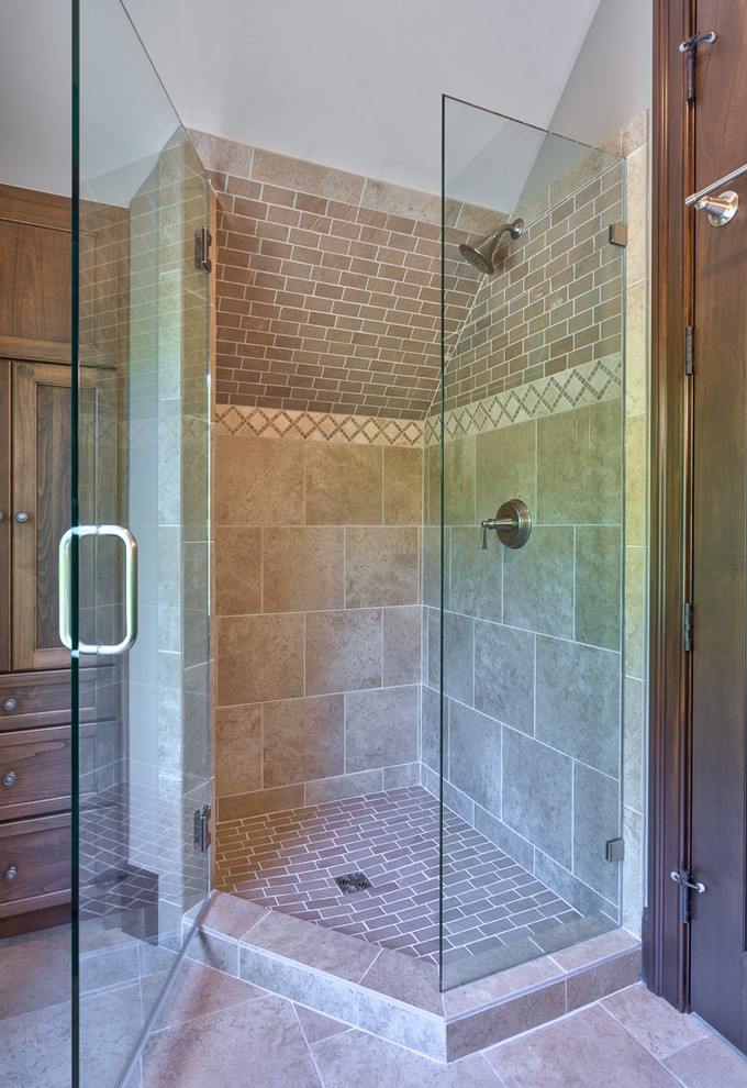 Corner shower - mid-sized rustic 3/4 brown tile and ceramic tile ceramic tile and beige floor corner shower idea in Other with recessed-panel cabinets, brown cabinets, tile countertops, a hinged shower door and a built-in vanity