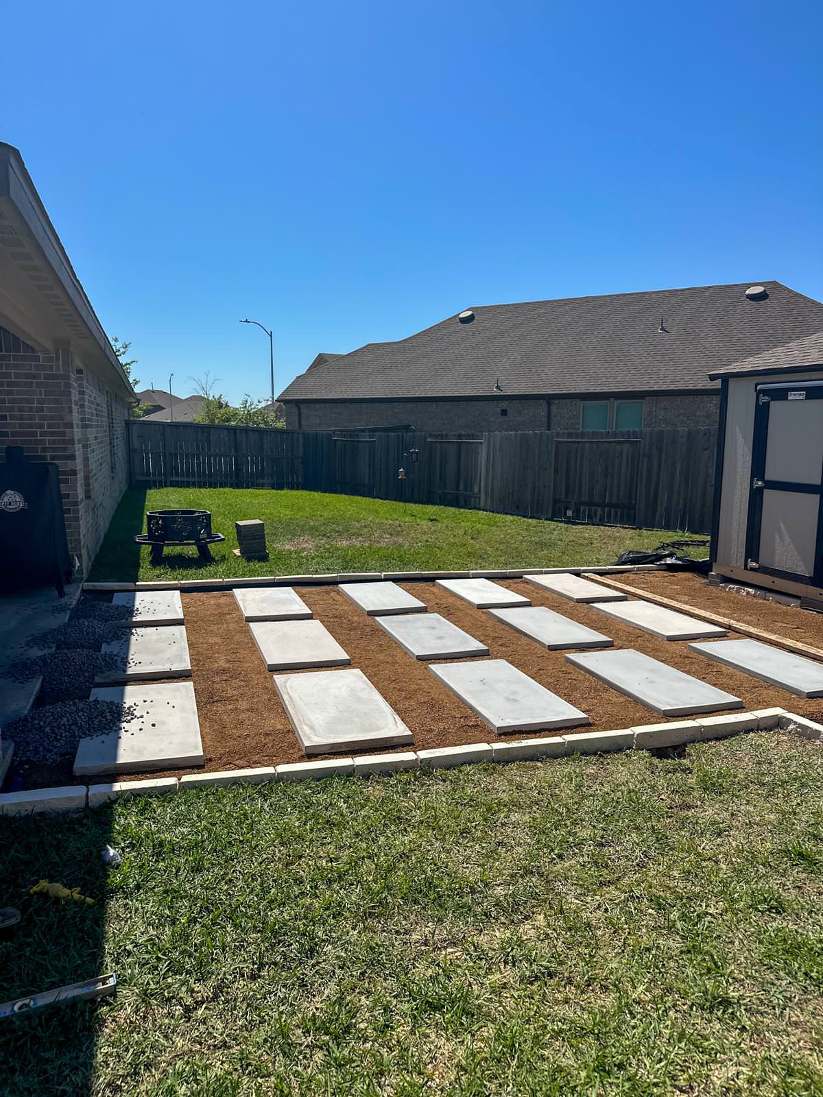 Backyard paver patio with gravel!