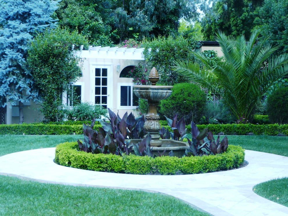 This is an example of a large backyard stone formal garden in San Francisco for summer.