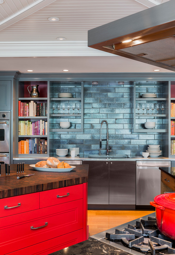 This is an example of a large contemporary l-shaped eat-in kitchen in Boston with red cabinets, wood benchtops, blue splashback, porcelain splashback, stainless steel appliances, medium hardwood floors and multiple islands.