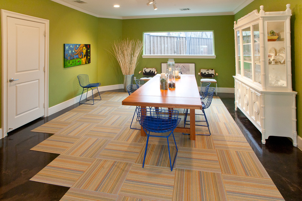 Inspiration for a modern dining room in Dallas with green walls.