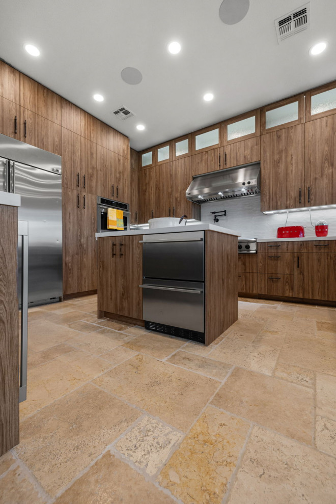 Enclosed kitchen - rustic l-shaped slate floor and beige floor enclosed kitchen idea with a single-bowl sink, flat-panel cabinets, medium tone wood cabinets, quartzite countertops, white backsplash, glass sheet backsplash, stainless steel appliances, a peninsula and white countertops