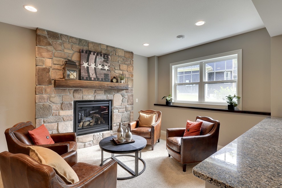 This is an example of a large transitional look-out basement in Minneapolis with beige walls, carpet, no fireplace and a stone fireplace surround.