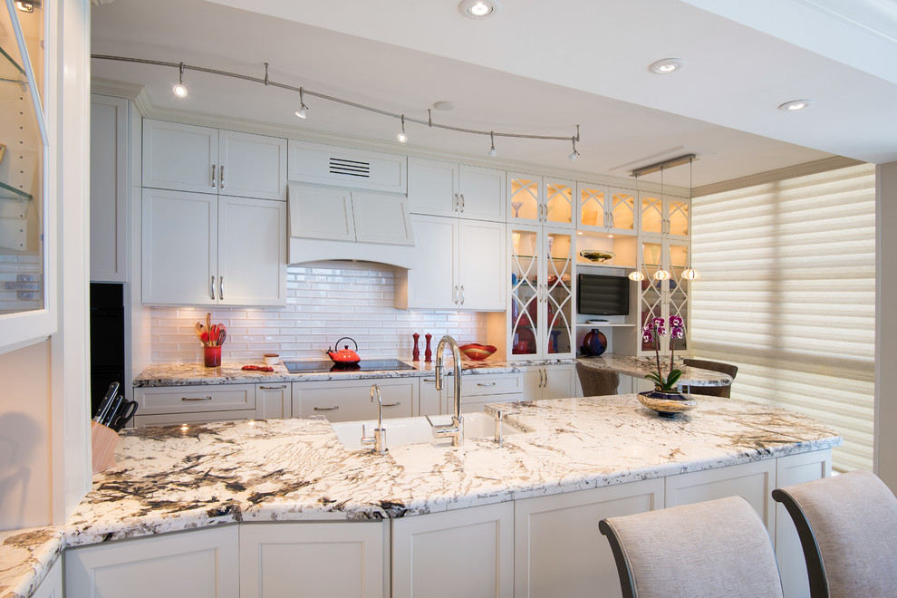Inspiration for a mid-sized timeless galley eat-in kitchen remodel in Miami with a farmhouse sink, recessed-panel cabinets, beige cabinets, granite countertops, beige backsplash, subway tile backsplash, paneled appliances and no island