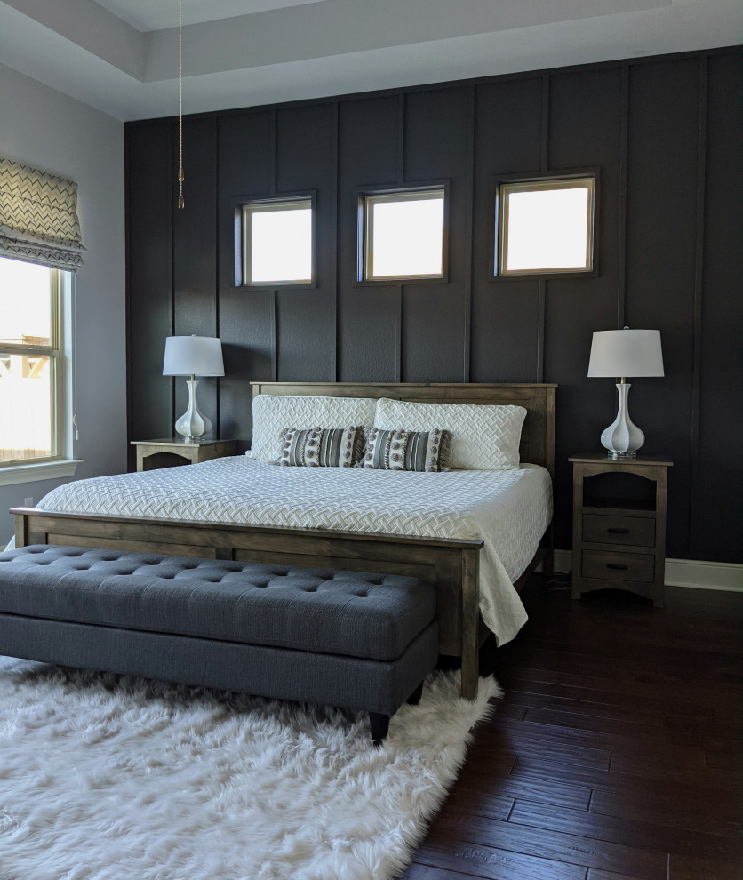 Photo of a mid-sized transitional master bedroom in Austin with beige walls, medium hardwood floors, brown floor and recessed.