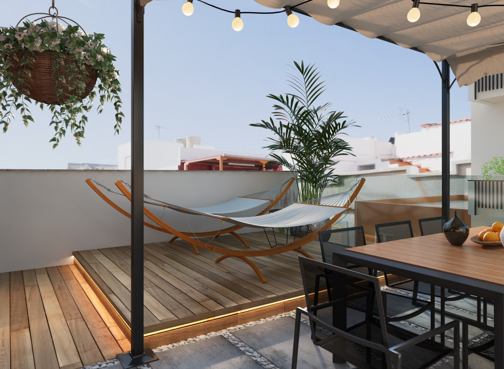 Ispirazione per una grande terrazza minimalista sul tetto e sul tetto con una pergola e parapetto in vetro