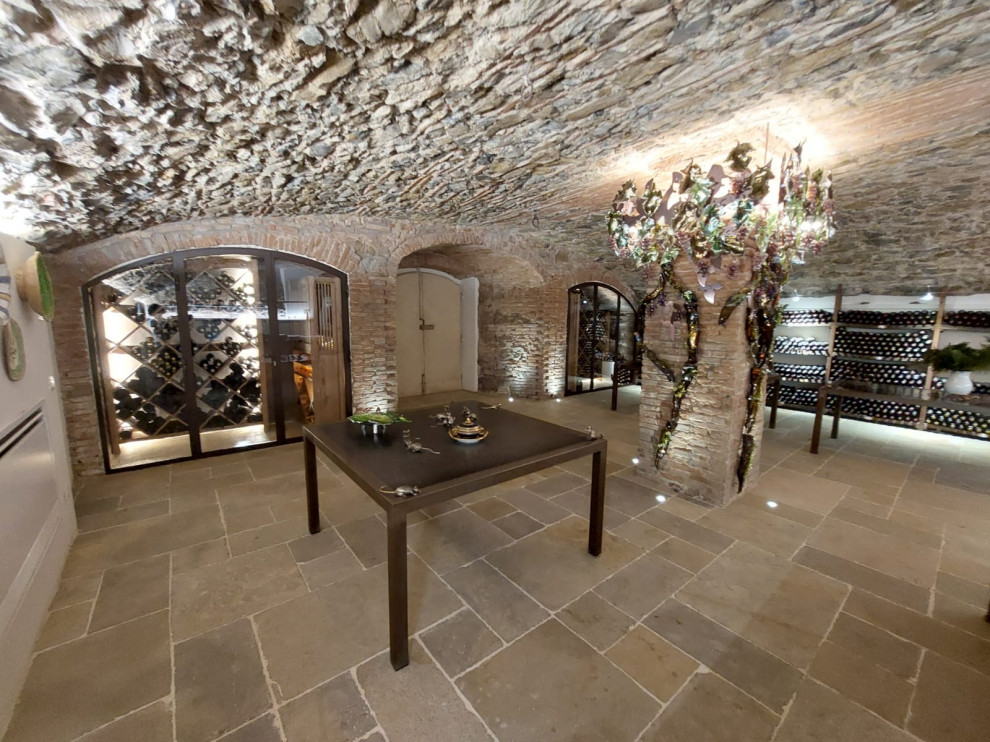 Mountain style wine cellar photo in Florence