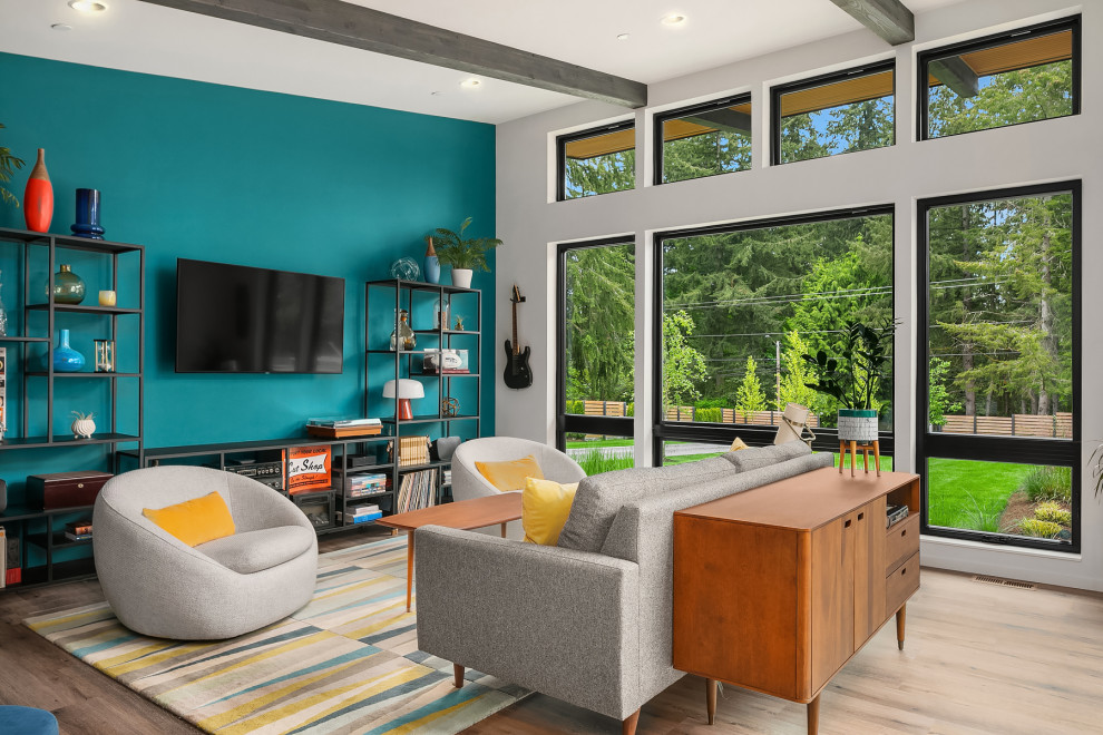 Design ideas for a contemporary grey and teal open plan living room in Seattle with white walls, medium hardwood flooring, no fireplace, a wall mounted tv and exposed beams.