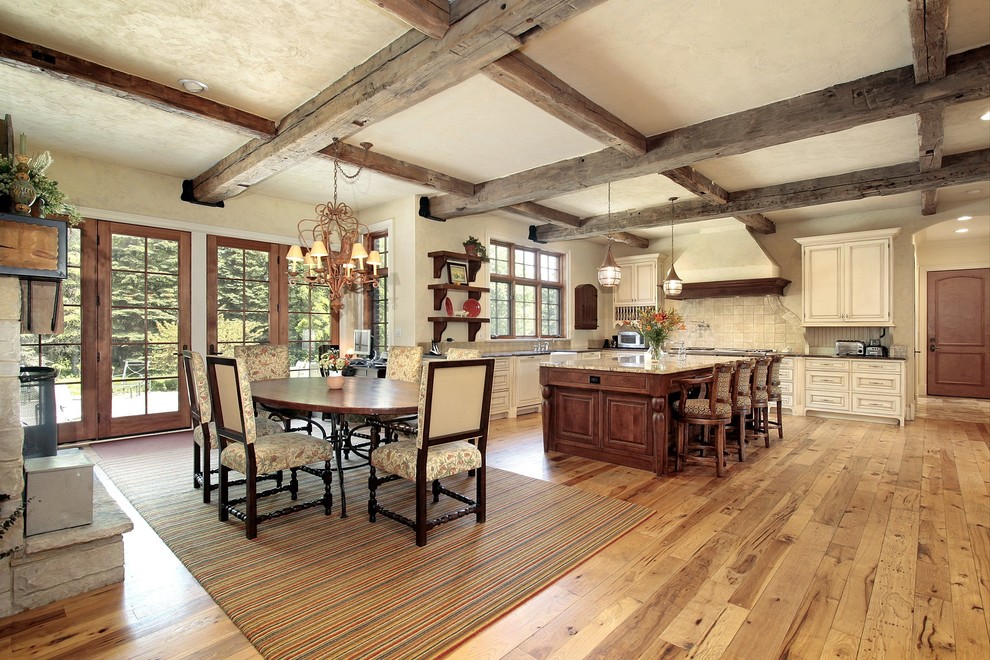 Huge mountain style l-shaped light wood floor eat-in kitchen photo in Atlanta with beaded inset cabinets, white cabinets, white backsplash and an island