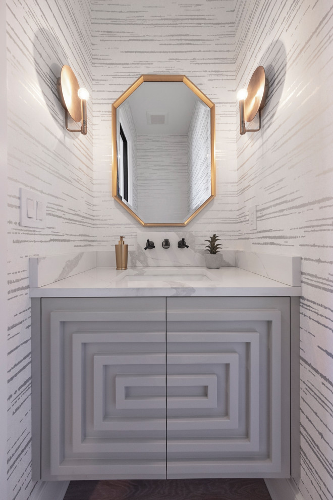 This is an example of a transitional powder room in Louisville.