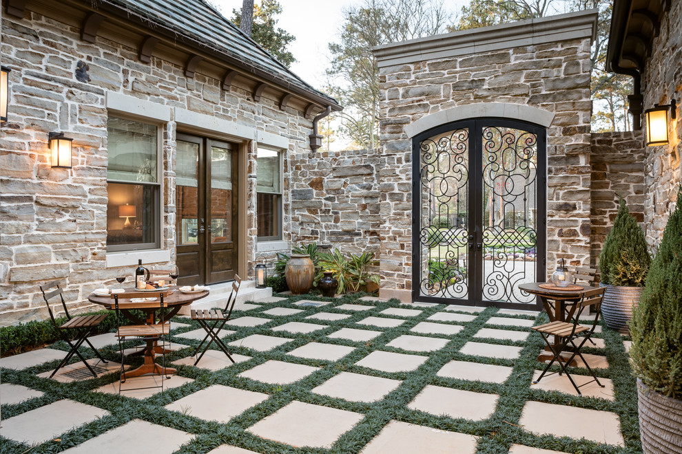 Photo of a traditional courtyard patio in Houston with no cover.