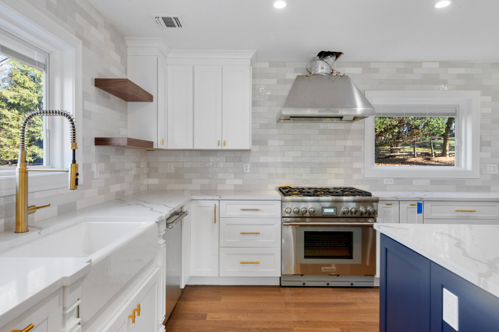 Kitchen with Professional Range and White Cabinetry