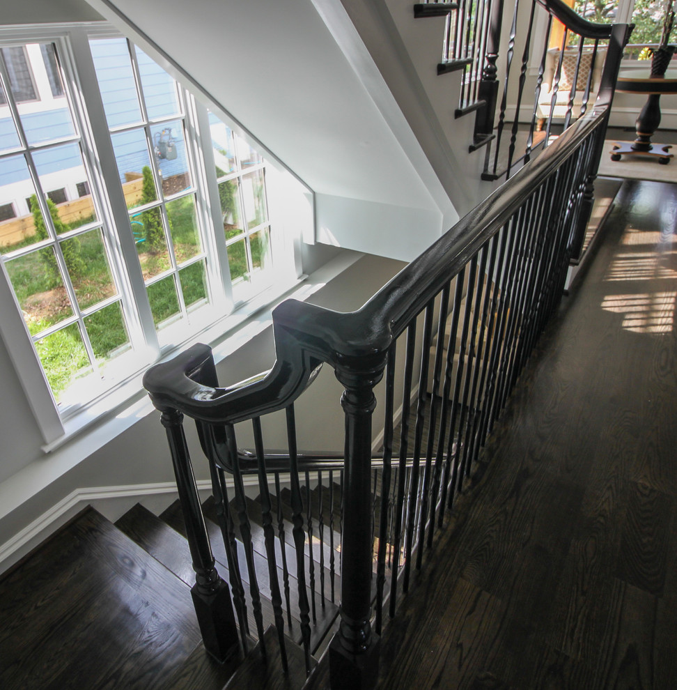 Example of a large transitional wooden l-shaped mixed material railing staircase design in DC Metro with painted risers