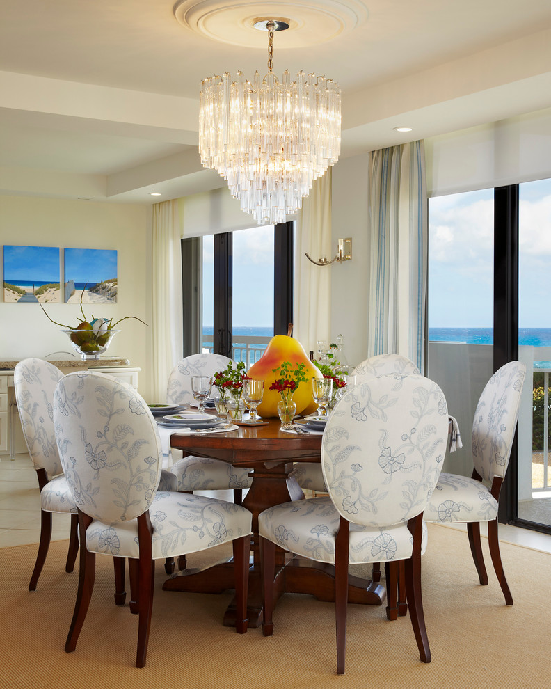 Photo of a transitional dining room in Miami with white walls.