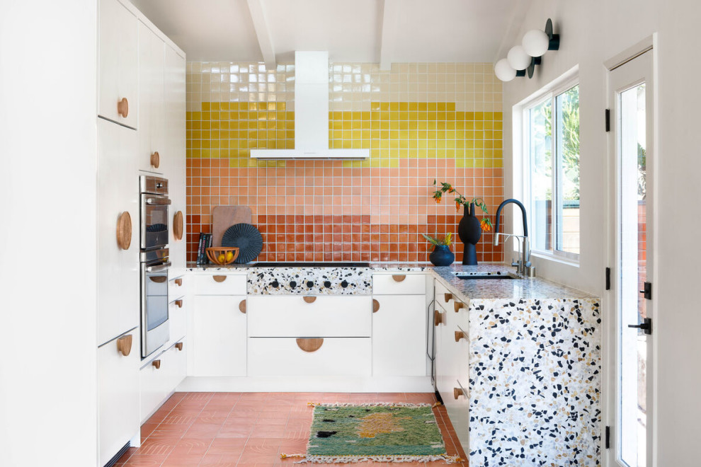 Inspiration for a mid-sized contemporary single-wall eat-in kitchen remodel in Los Angeles with multicolored backsplash, cement tile backsplash and stainless steel appliances