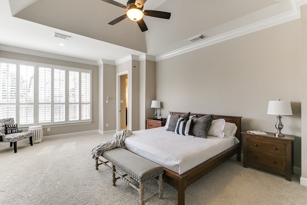 Design ideas for a large traditional master bedroom in Houston with beige walls, carpet, no fireplace and beige floor.