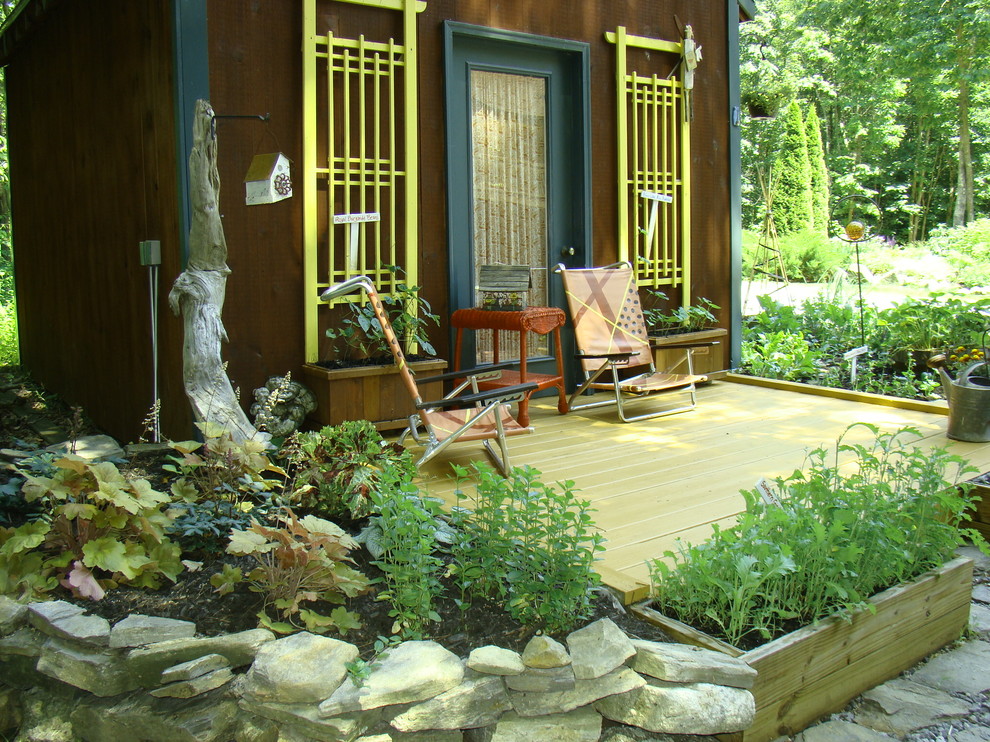 Country verandah in Portland Maine with a container garden.