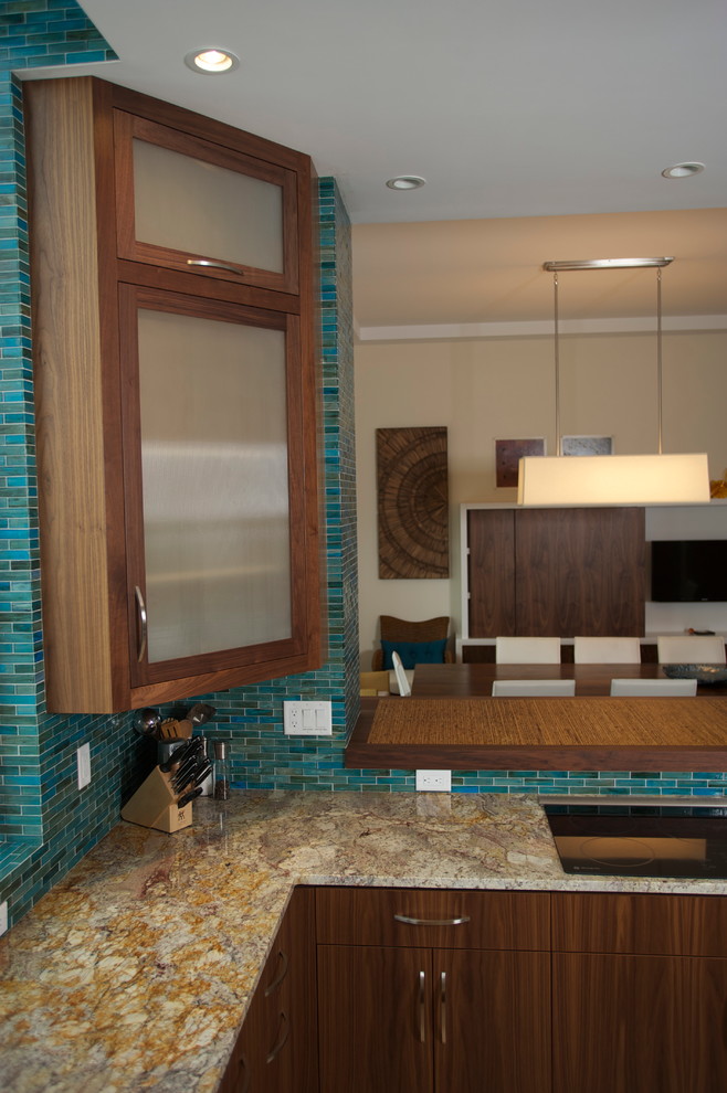 Photo of a mid-sized transitional u-shaped eat-in kitchen in Tampa with an undermount sink, flat-panel cabinets, medium wood cabinets, wood benchtops, blue splashback, glass tile splashback, stainless steel appliances, marble floors and with island.