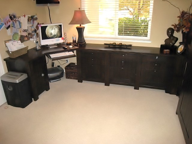 Inspiration for a small transitional study room in Sacramento with beige walls, carpet and a built-in desk.