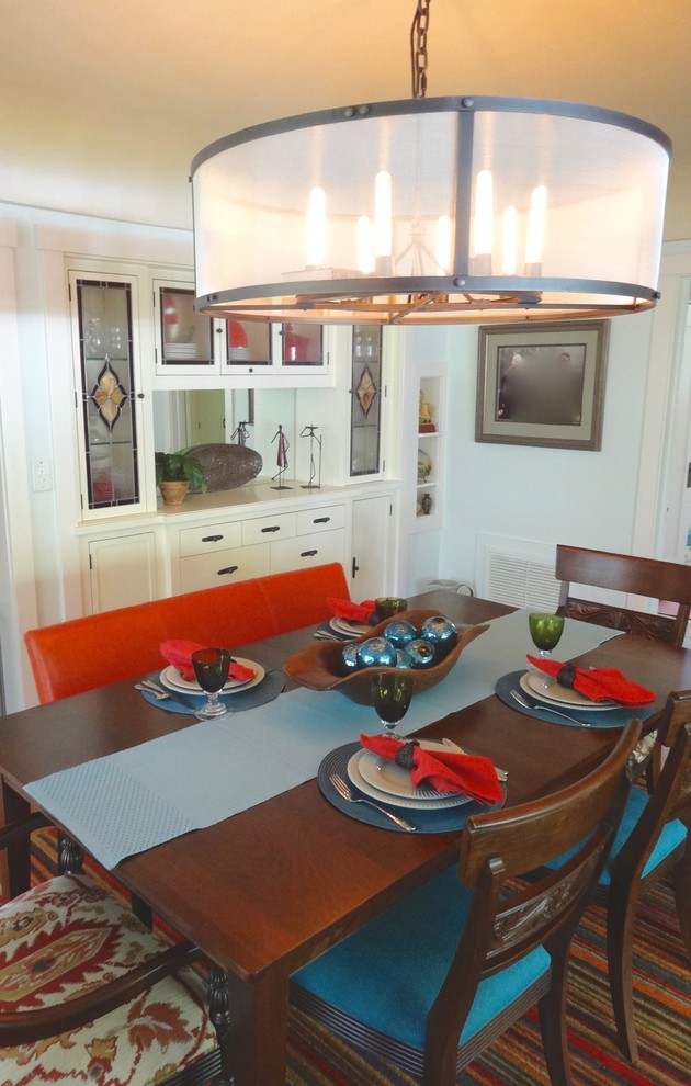 Design ideas for a small eclectic separate dining room in Orange County with blue walls and light hardwood floors.