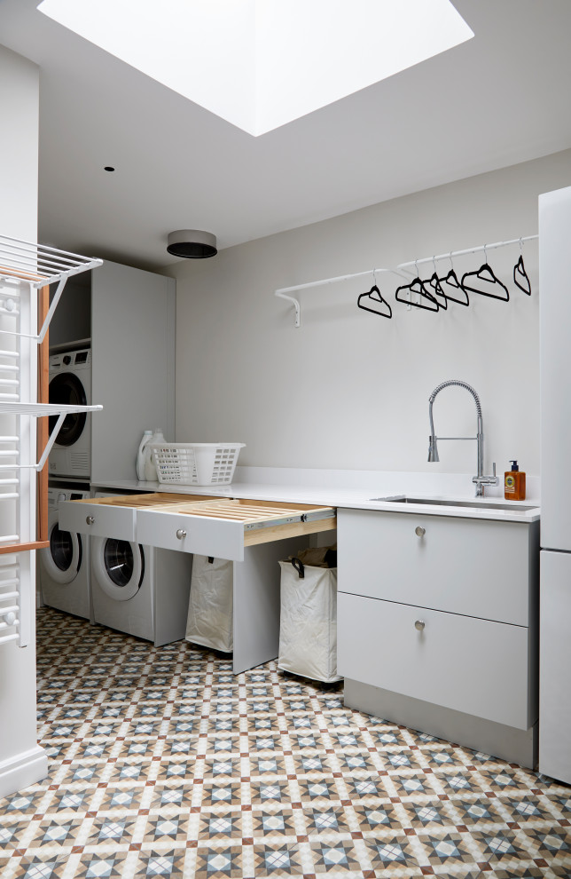 Laundry room - contemporary laundry room idea in London