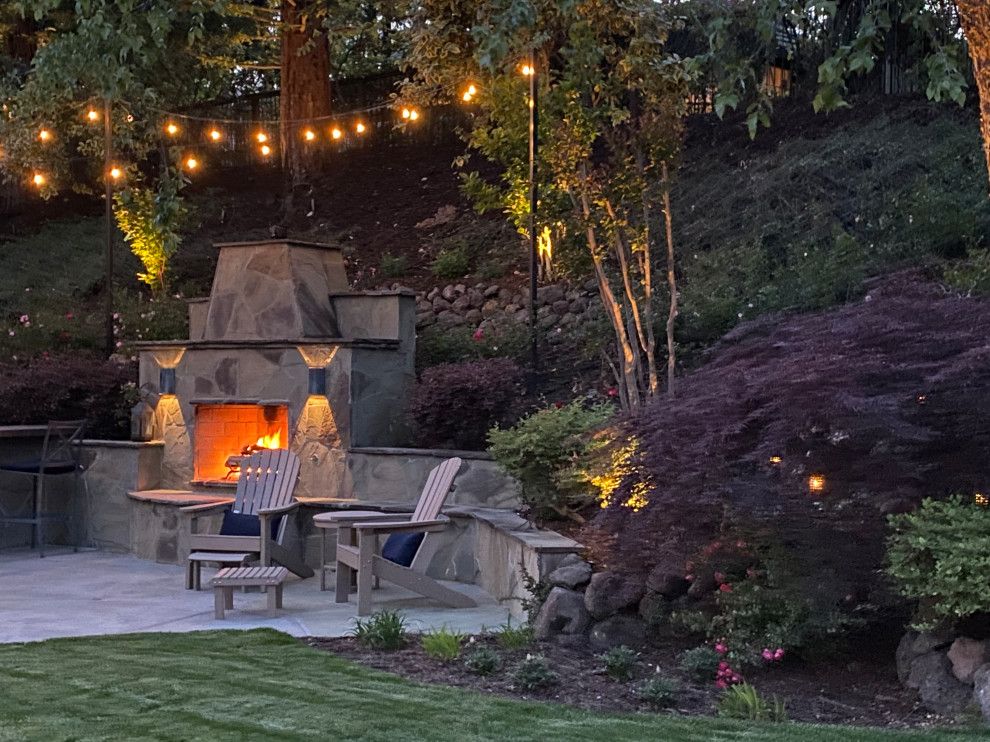 This is an example of a mid-sized traditional backyard garden in San Francisco with with fireplace.