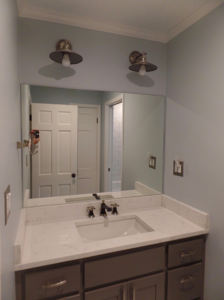 Alcove bathtub - mid-sized transitional kids' white tile and ceramic tile ceramic tile and white floor alcove bathtub idea with shaker cabinets, gray cabinets, a two-piece toilet, blue walls, an undermount sink, quartz countertops and white countertops