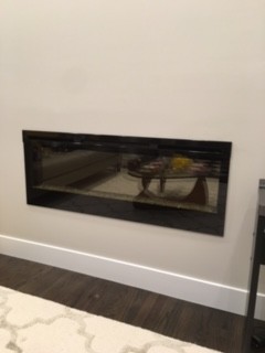 Mantel shelf above electric fireplace We got a Dimplex electric fireplace installed flush/built in to the living room wall. We