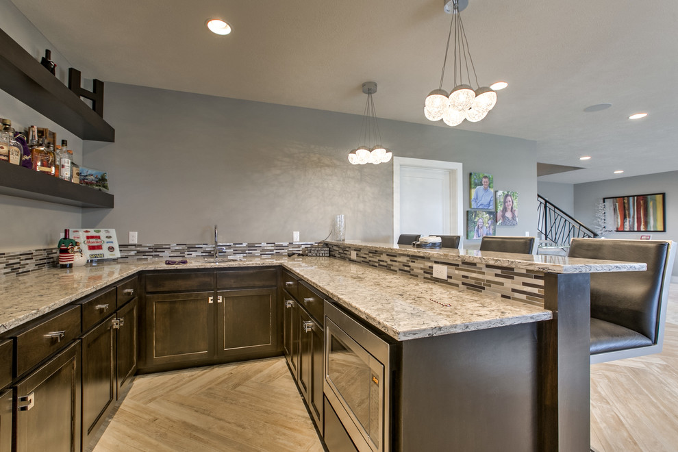 Transitional walk-out carpeted basement photo in Omaha with a ribbon fireplace and a stone fireplace