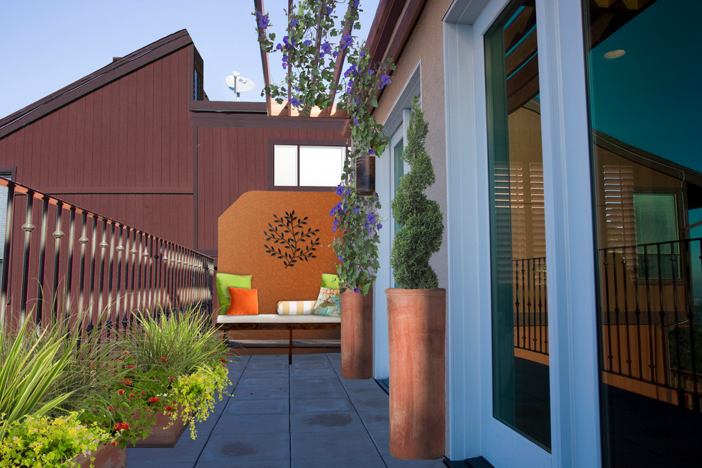 Design ideas for a small mediterranean backyard deck in San Francisco with a pergola.