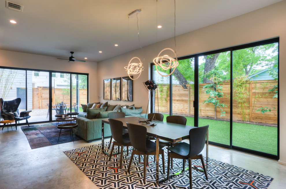 Photo of a large contemporary open plan dining in Austin with beige walls, porcelain floors and no fireplace.
