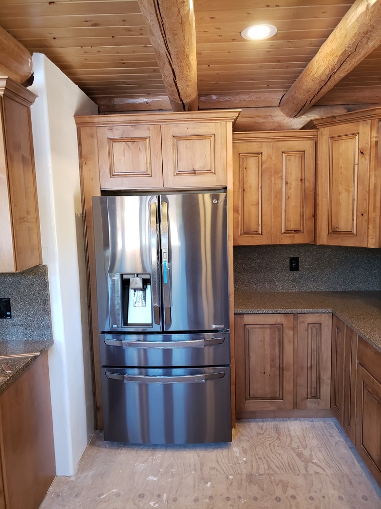 Kitchen - rustic kitchen idea in Phoenix with medium tone wood cabinets