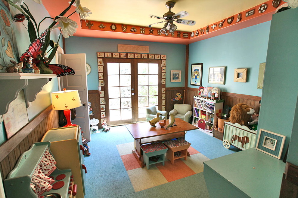 Design ideas for a mid-sized beach style gender-neutral kids' playroom for kids 4-10 years old in Seattle with blue walls and carpet.