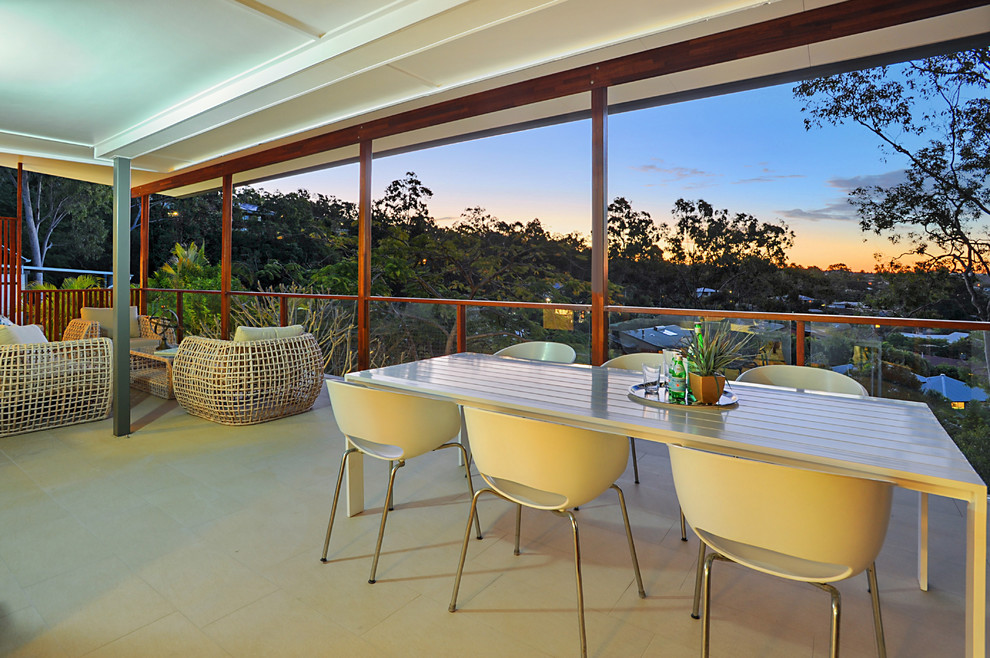 Design ideas for a mid-sized contemporary backyard deck in Brisbane.
