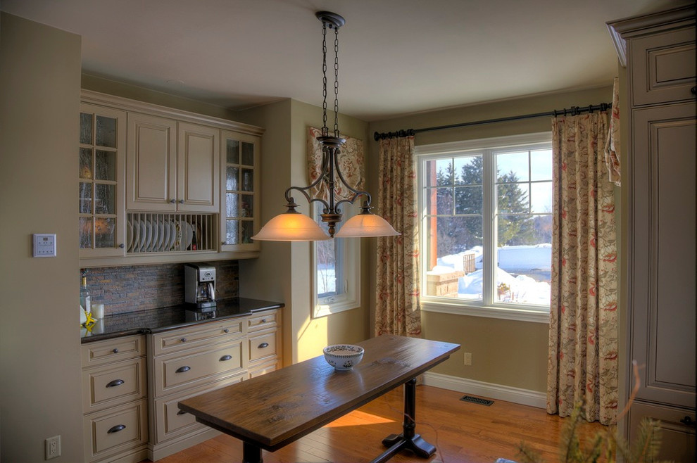 Example of a transitional kitchen design in Toronto
