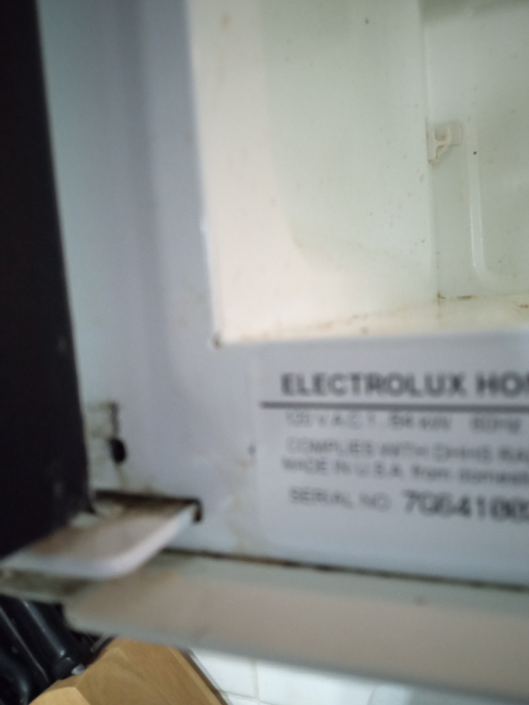 Fridigaire over range microwave door hinge loose