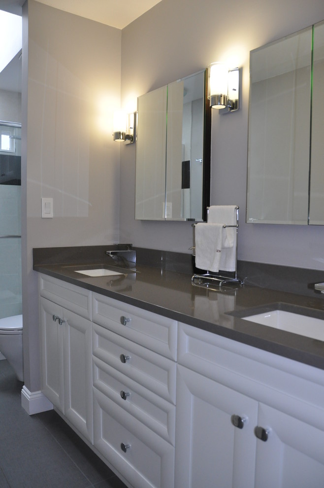 This is an example of a mid-sized modern master bathroom in Vancouver with an undermount sink, flat-panel cabinets, white cabinets and quartzite benchtops.