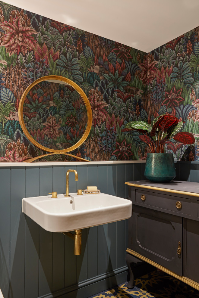 Design ideas for a traditional powder room in London with multi-coloured walls, a wall-mount sink, multi-coloured floor, planked wall panelling, decorative wall panelling and wallpaper.